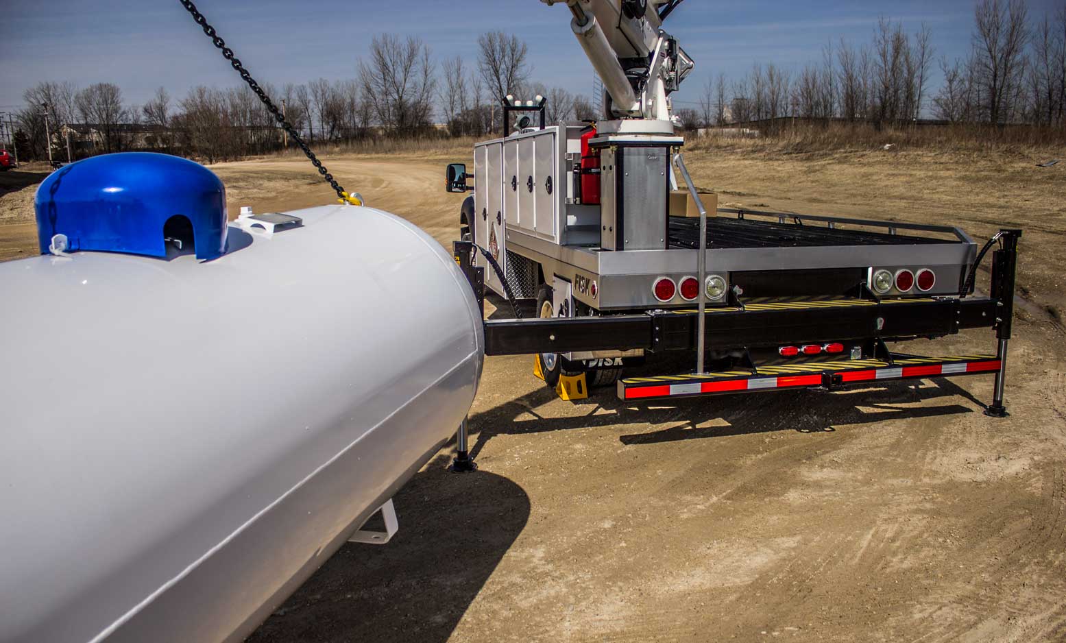 Boom truck lifting a propane tank