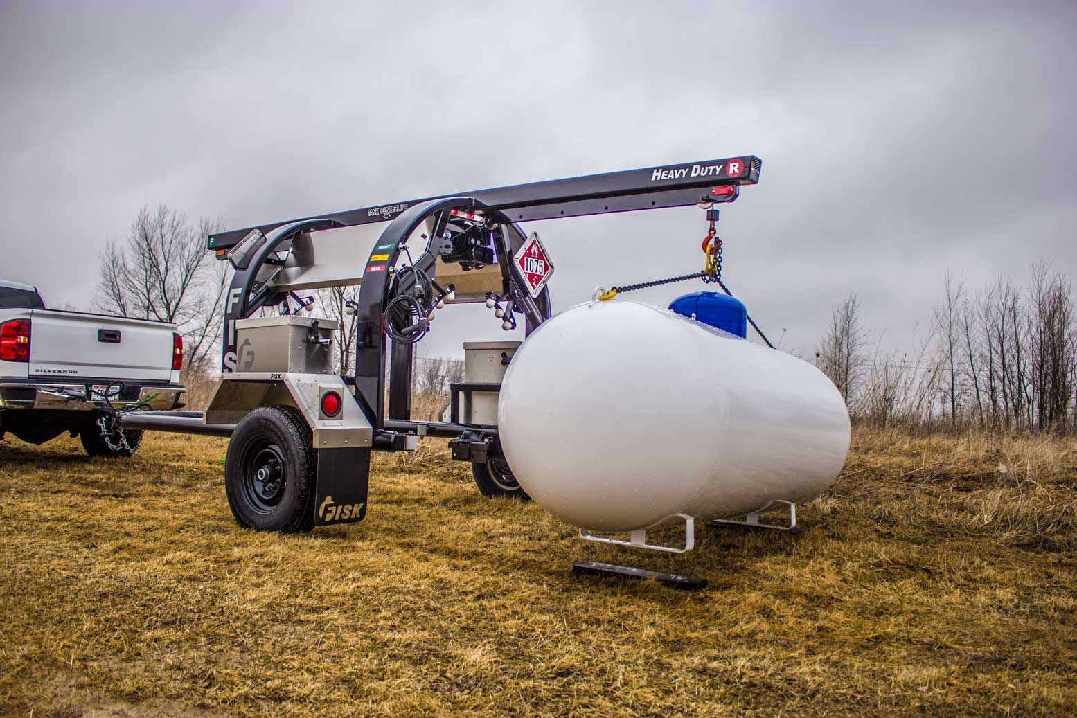 Service trailer lifting a propane tank