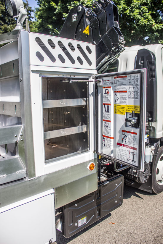 Additional storage on the side of a service truck