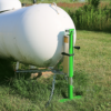 Propane tank jack lifting a propane tank in a field