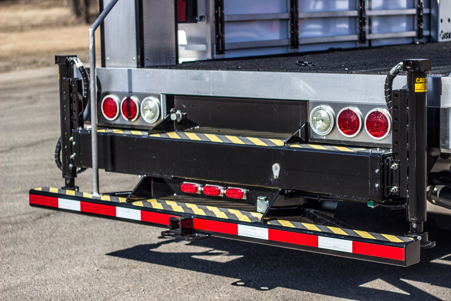 Step-up bumper on a service truck