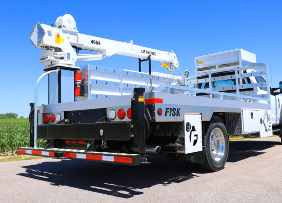 A Fisk utility truck with a crane on the back