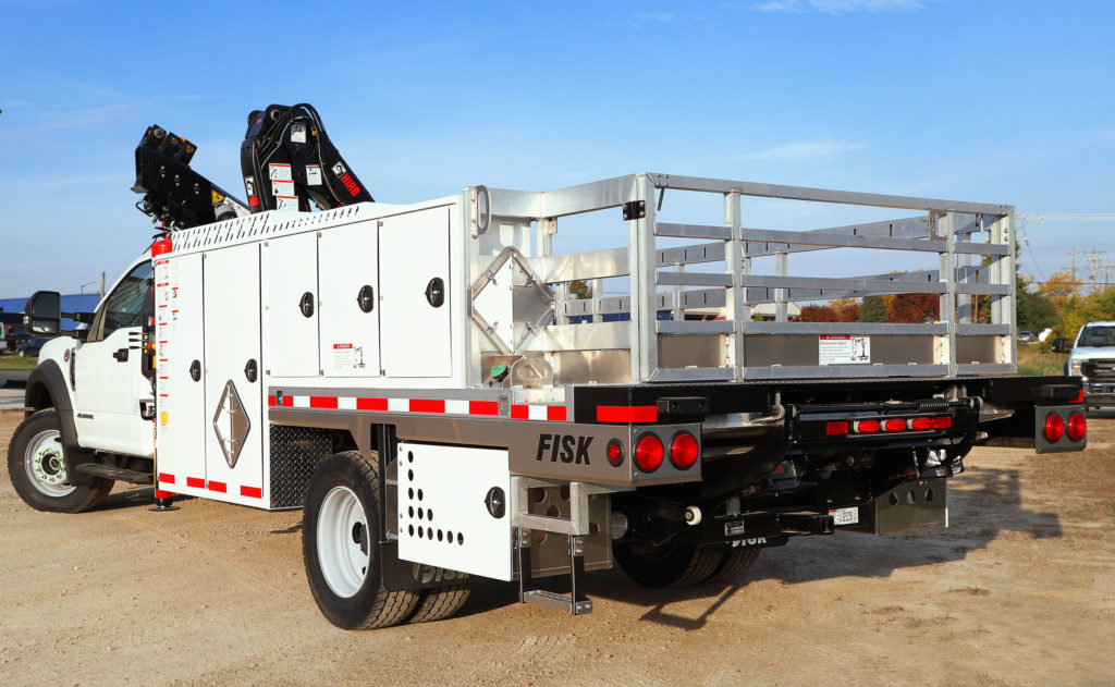 Rearview of the FISK TX1 White Knuckle Boom Truck with aluminum truck bed, ladder, storage space and LED lighting