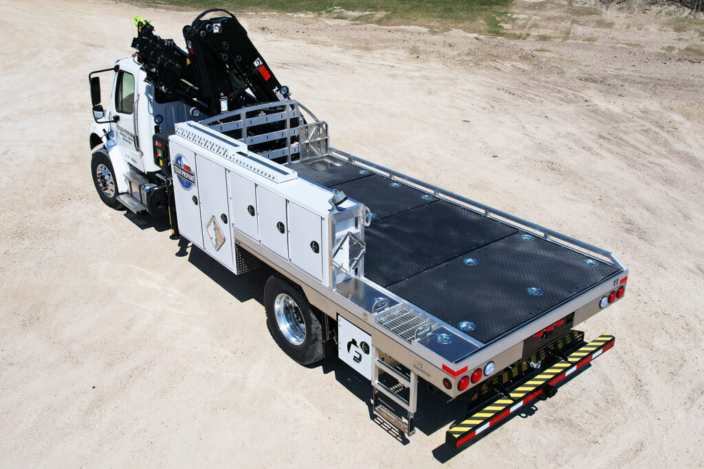 Image contains a Fisk TX-3 propane truck back end with side storage boxes and bed.